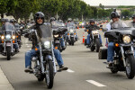 Group of motorcycle riders on road